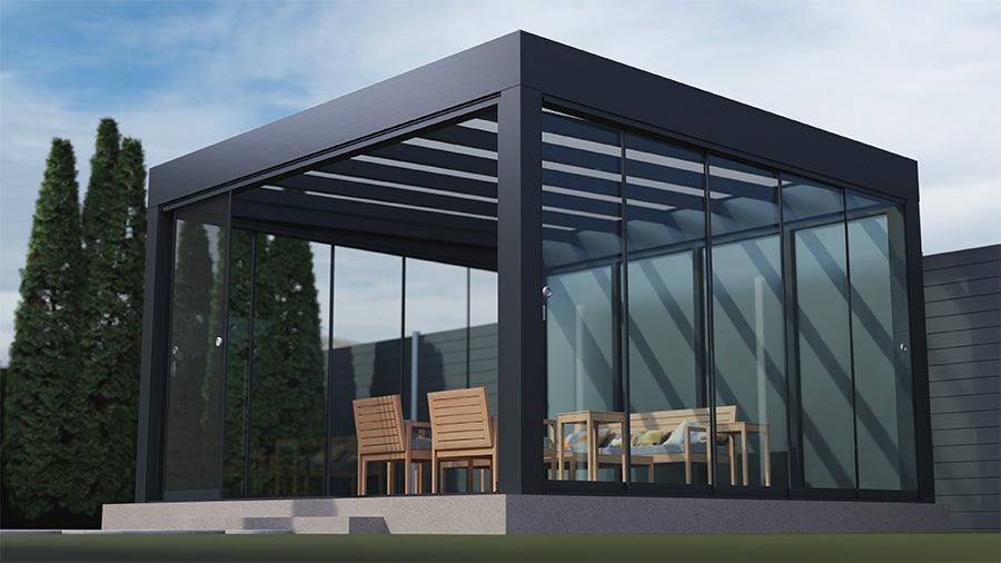 Modern glass veranda with black frame, outdoor dining set, and garden setting