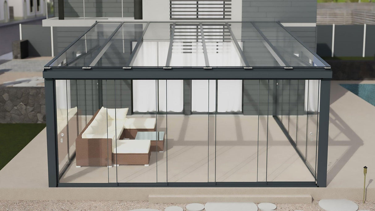 Modern glass garden room with lounge furniture and sleek metal frame, attached to house