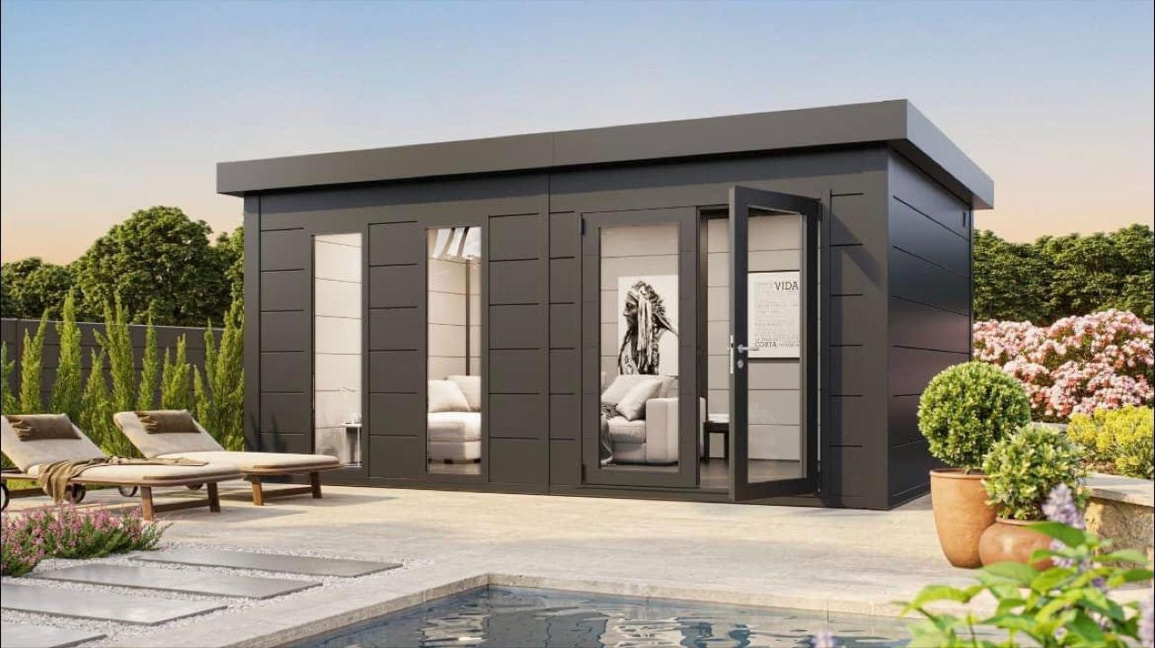 Modern garden room with glass doors, lounge chairs, and poolside greenery for outdoor relaxation