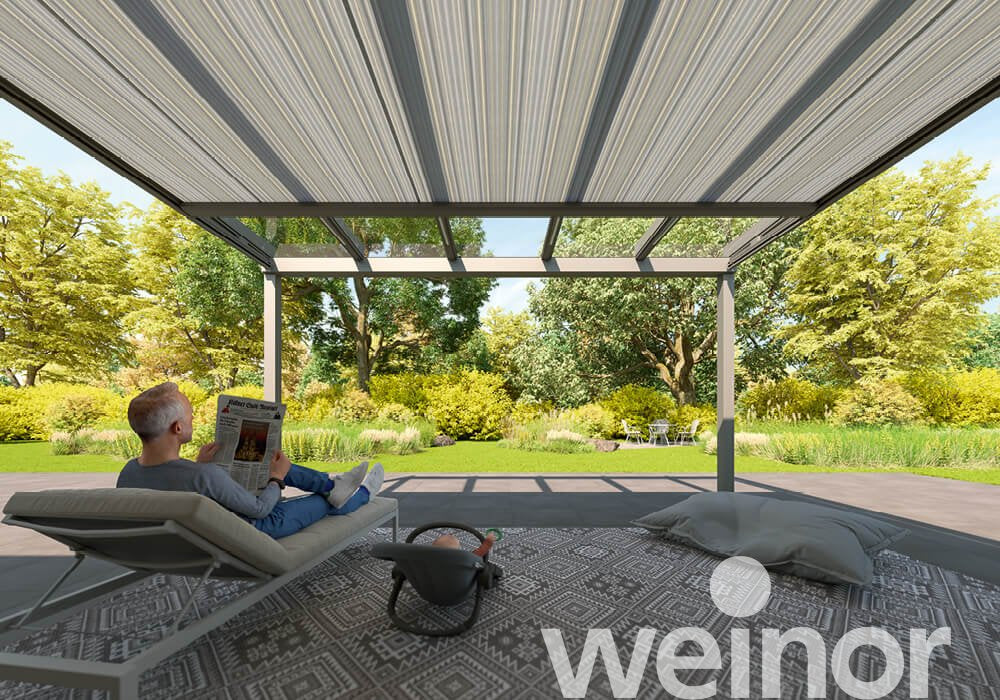 Man relaxing under modern pergola in lush garden, enjoying outdoor living space