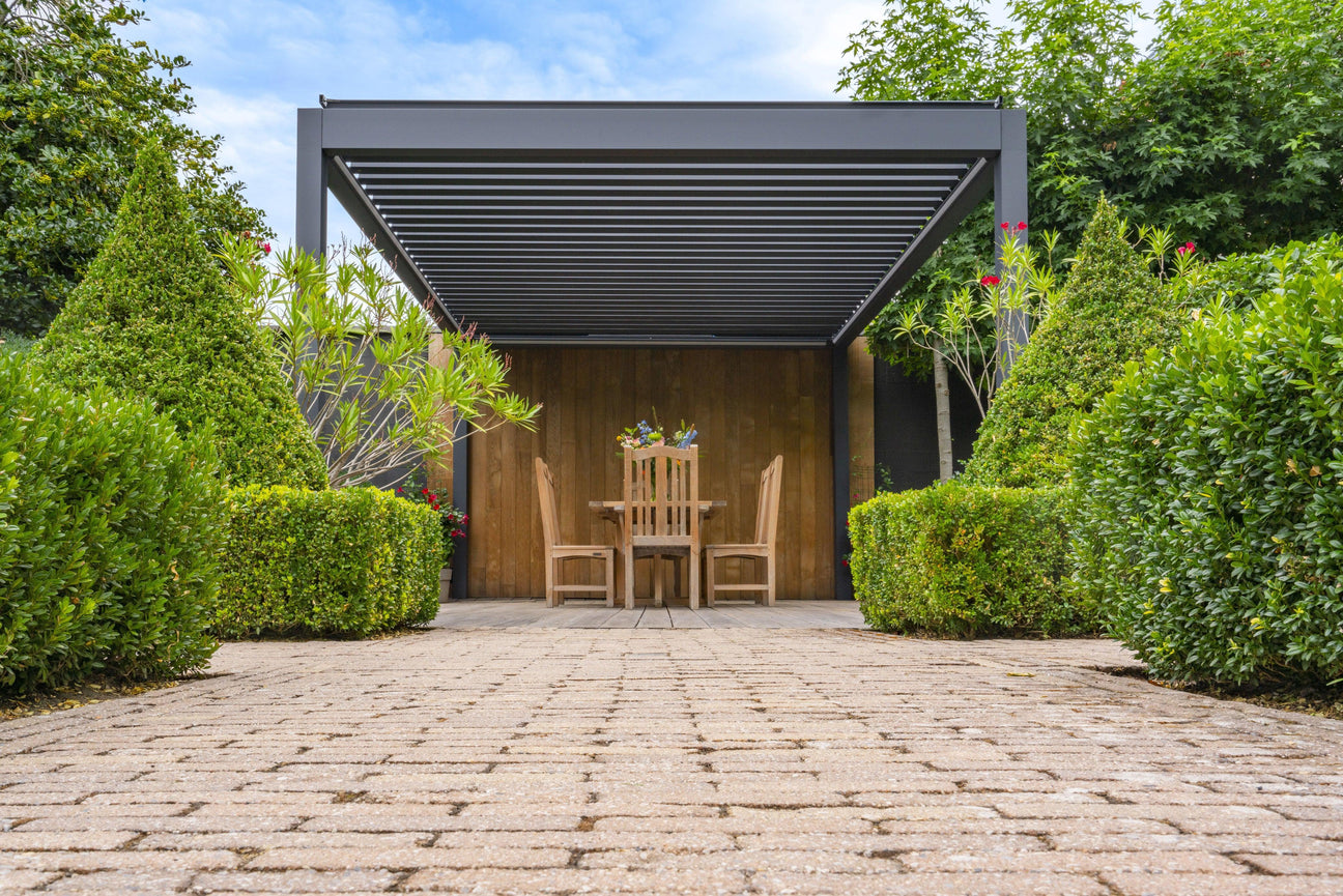 Modern pergola with wooden dining set in lush garden, perfect for outdoor living spaces