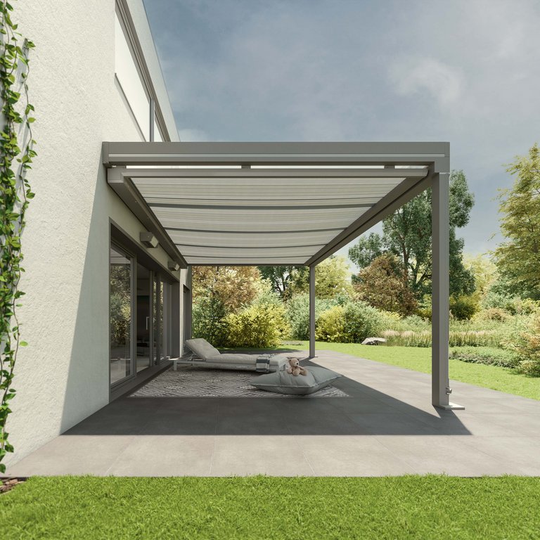 Modern garden patio with retractable awning and lounge chairs, surrounded by greenery.