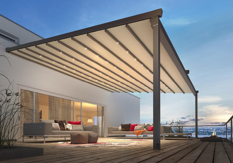 Modern outdoor pergola with LED lighting over wooden deck, enhancing evening garden living space