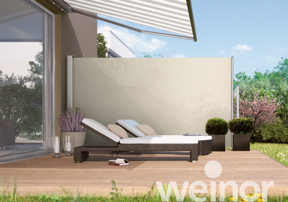 Modern garden patio with sun lounger, retractable awning, privacy screen, outdoor plants